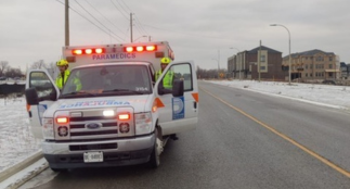 A Durham ambulance parked on the shoulder of a road.