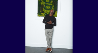 A head shot of Isaac with a blurred background.