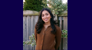 A head shot of Nilo with a blurred background.