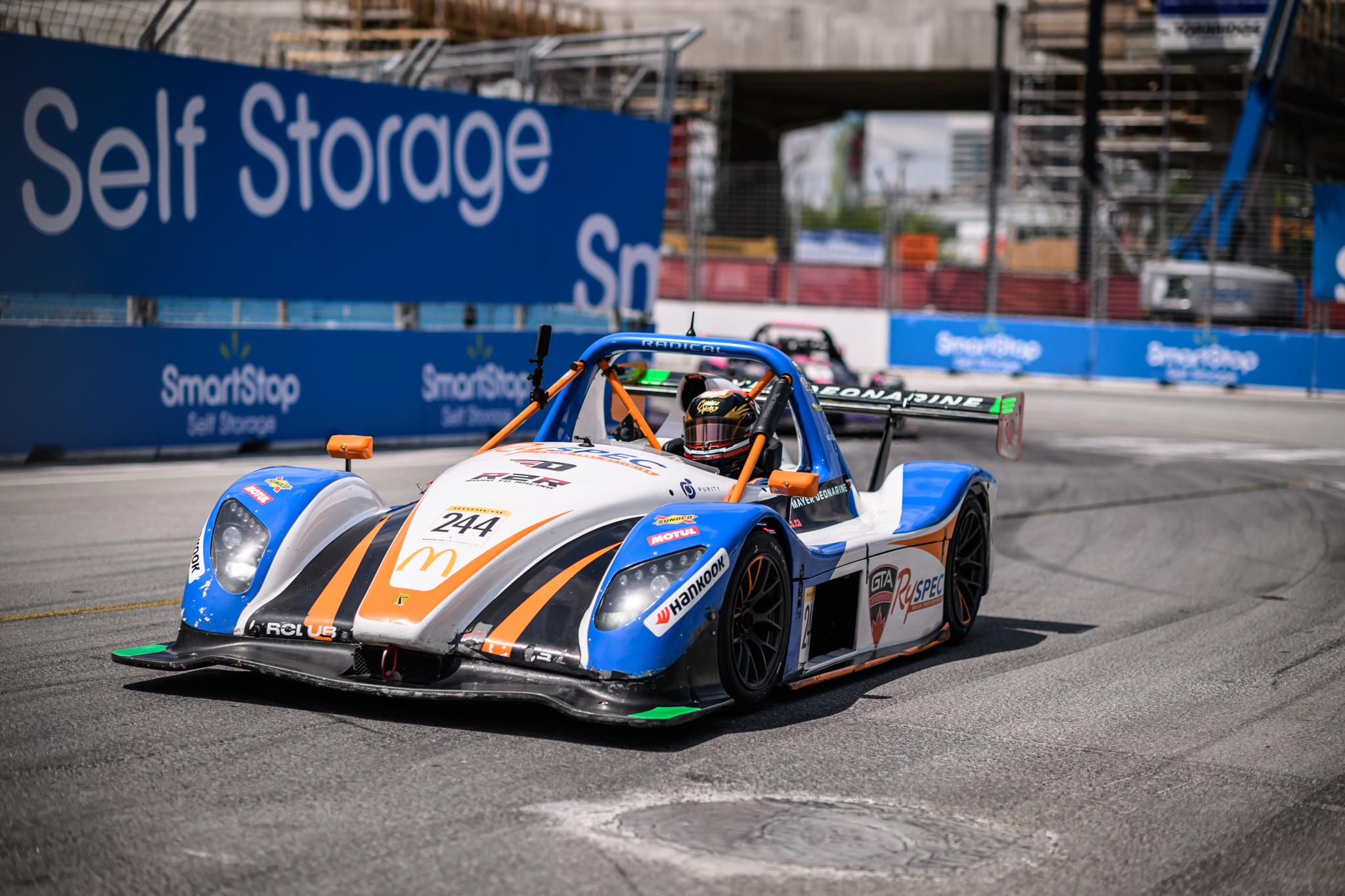 Mayer driving a race car on a track