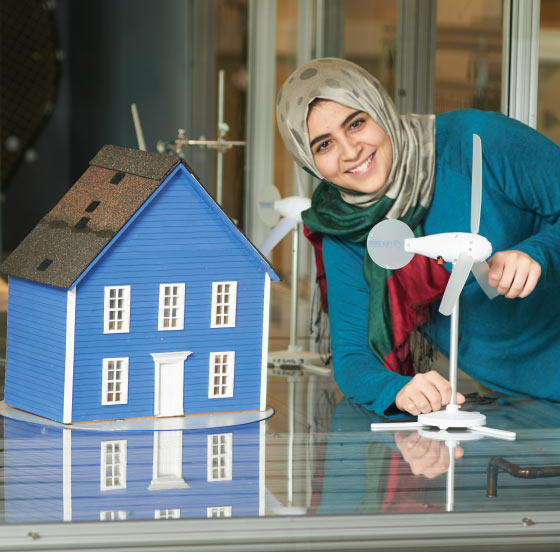 Ontario Tech University student in a wind energy lab