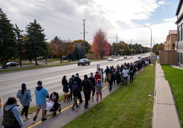 Action image of people walking on the IPV walk.