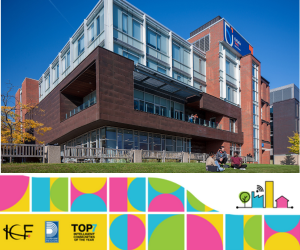 A photo of the outside of an Ontario Tech University building, with students sitting on the grass in front of the building.