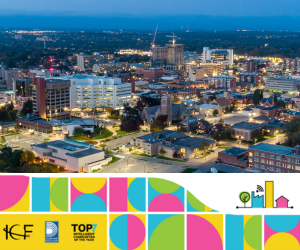 The City of Oshawa skyline with an pink, blue green and yellow abrstract border along the bottom, From left to right, ICF and Durham Region logos, and the Top 7 Intelligent communities of the year badge