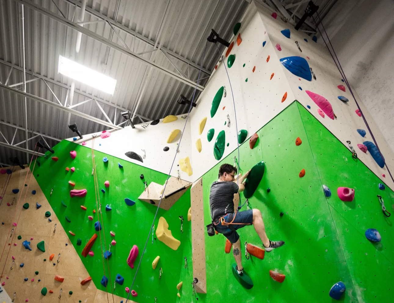 Person rock climbing at Aspire Climbing in Whitby, Ontario