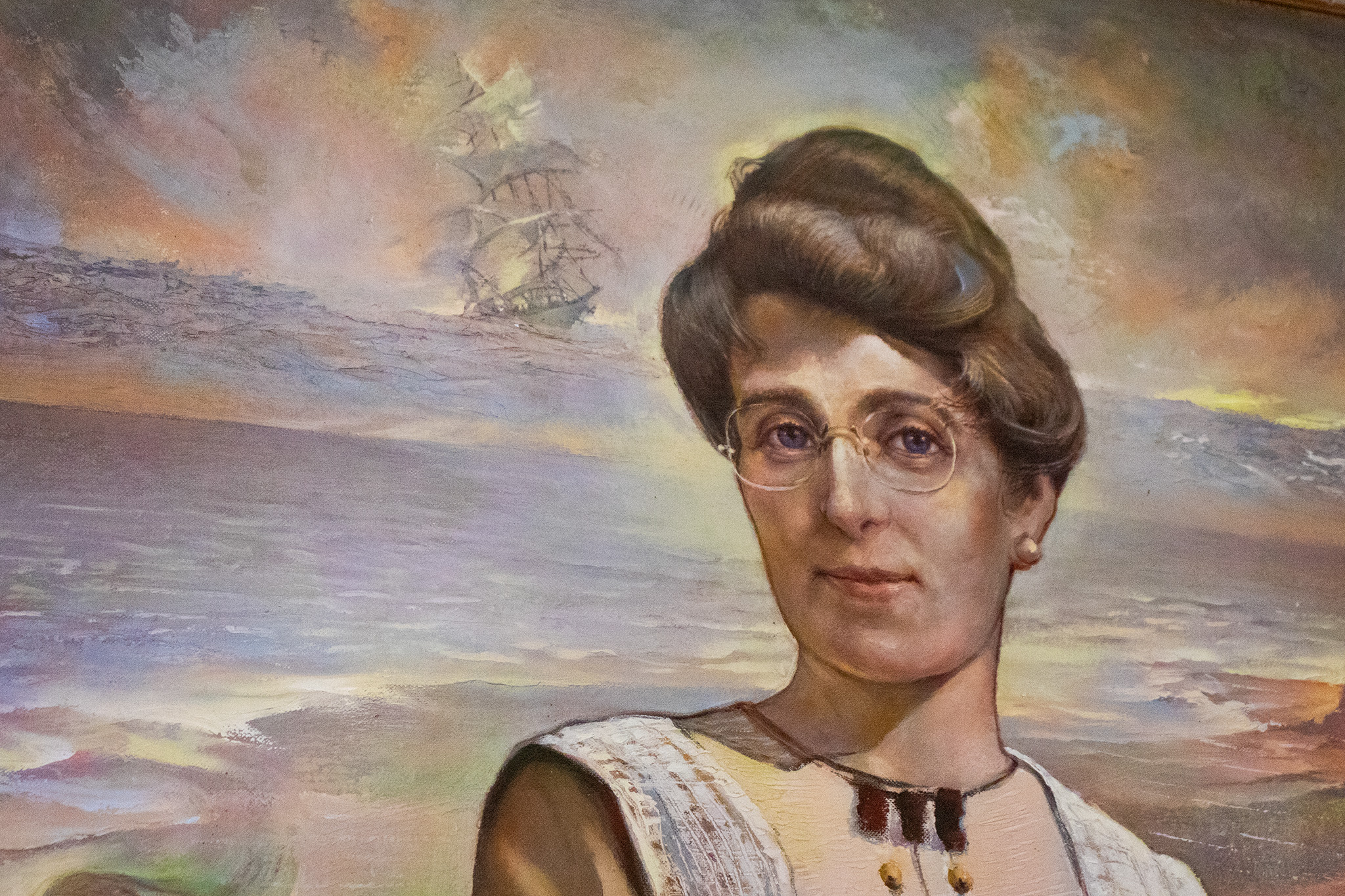 Image of a painting of Lucy Maud Montgomery on display in the entry of the Leaskdale Manse