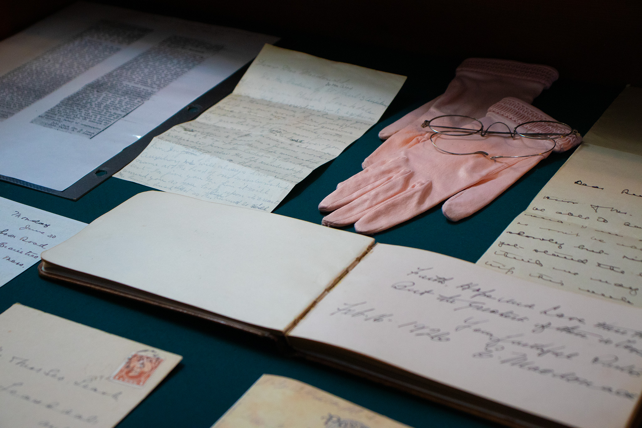 Image of collection of documents, letters, gloves, and glasses at the Historic Leaskdale Church