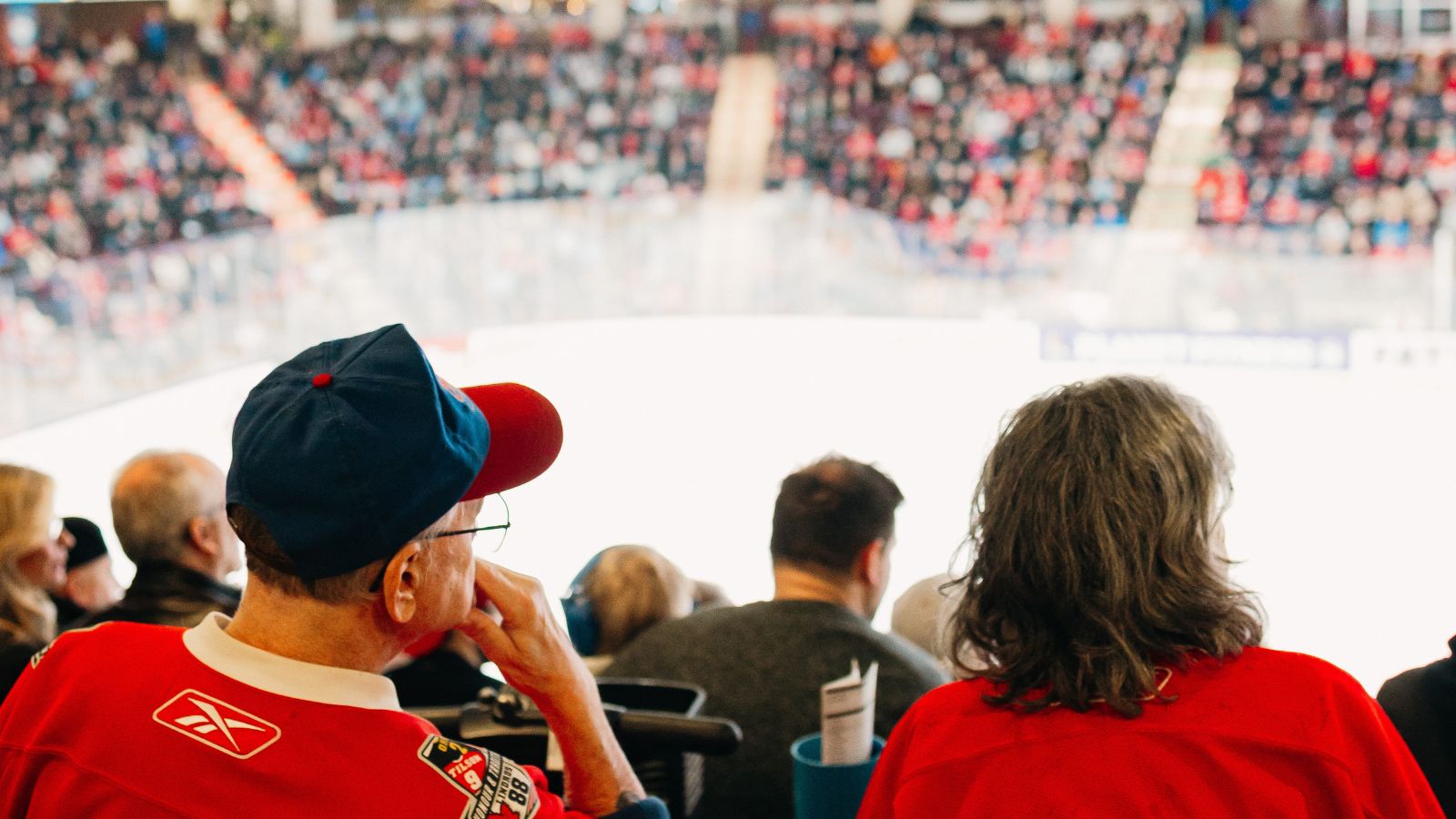 Image of a crowd wearing jerseys watching an Oshawa Generals  hockey game