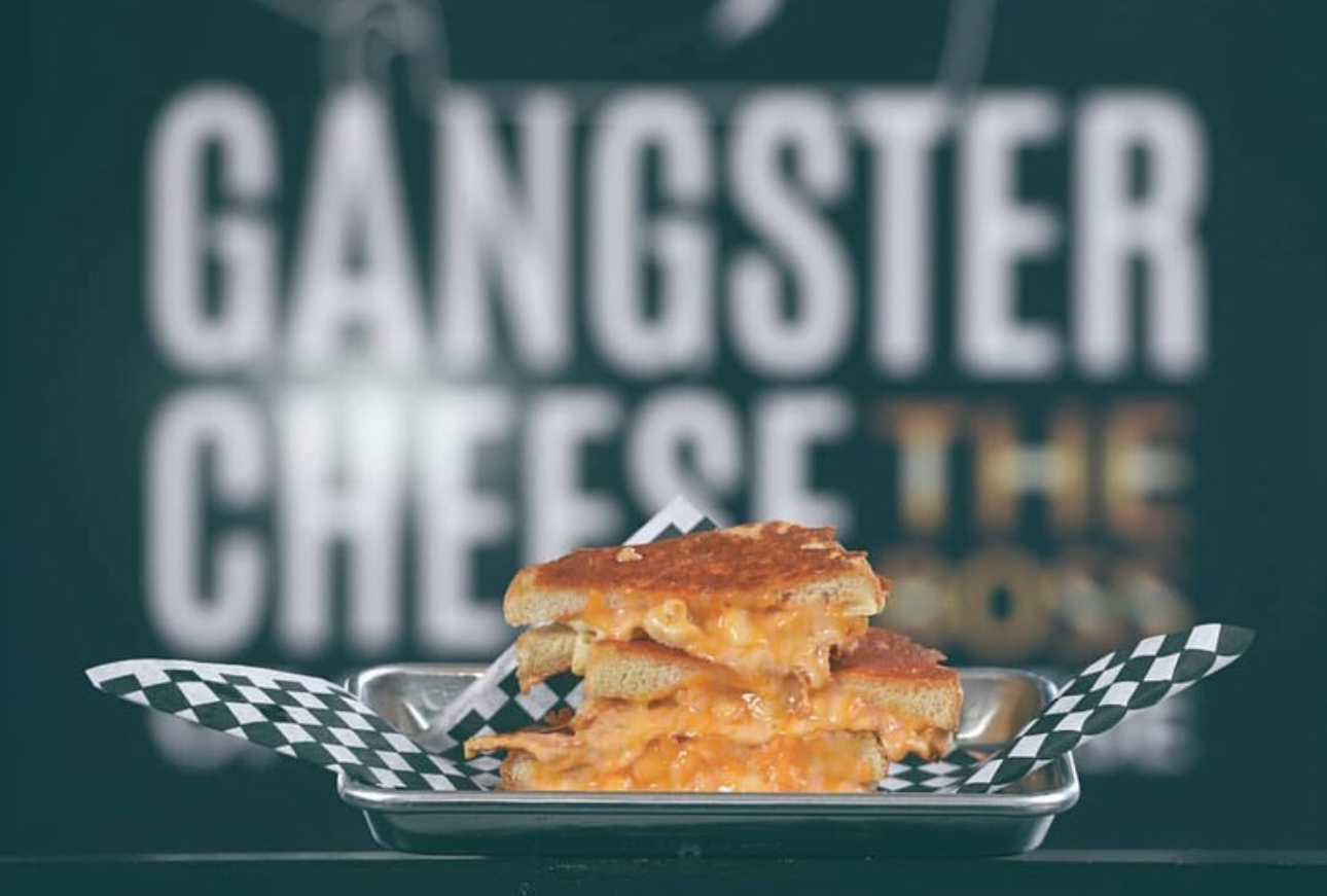 Image of a grilled cheese sandwich stuffed with mac and cheese