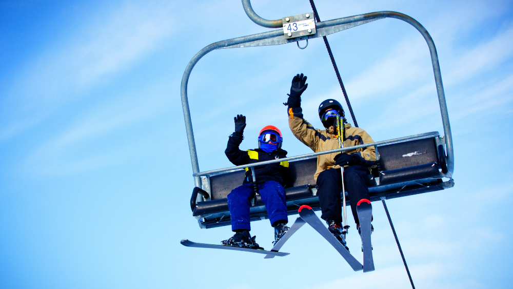 People waving on a ski lift in Durham Region, Ontario