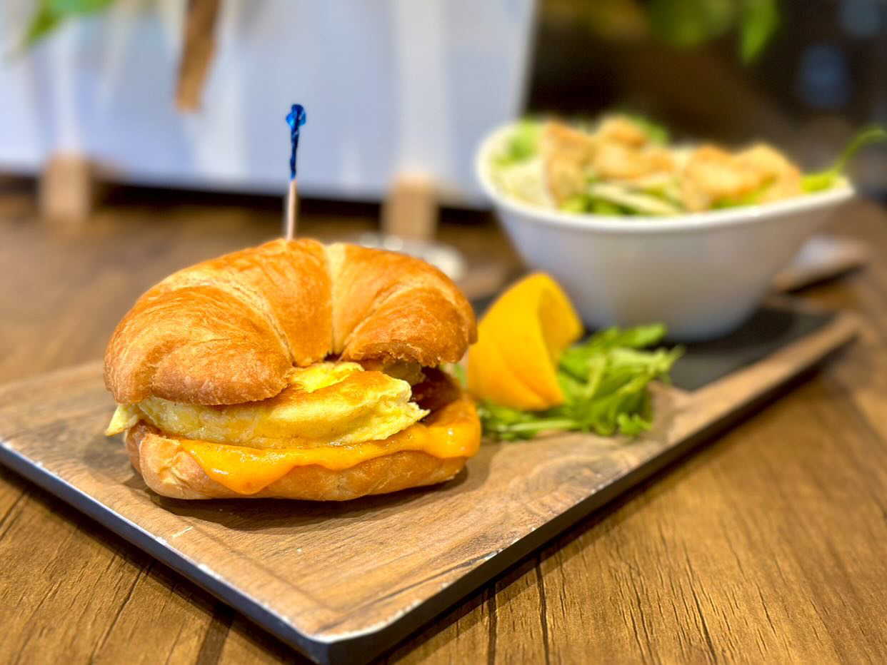 Image of a breakfast sandwich served on a croissant