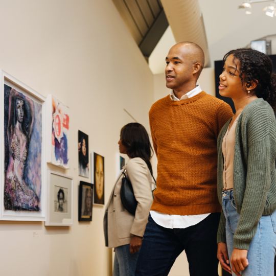 Two people enjoying art at a museum in Durham Region, Ontario