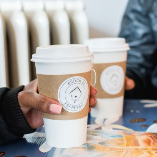 Two people enjoying coffee at Brock Street Espresso in Whitby, Ontario