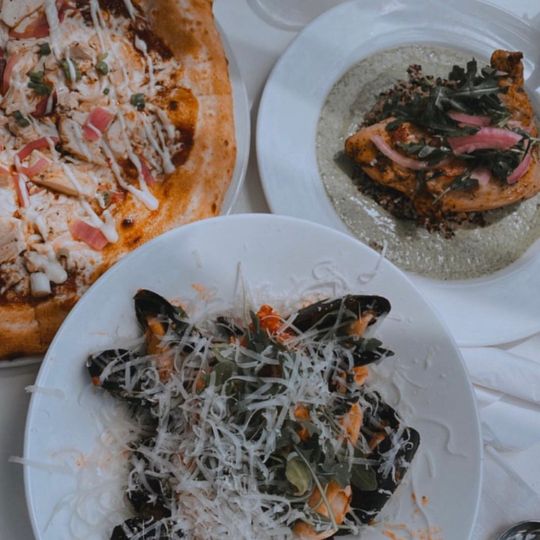 Three plates of food at PORT restaurant in Pickering, Ontario