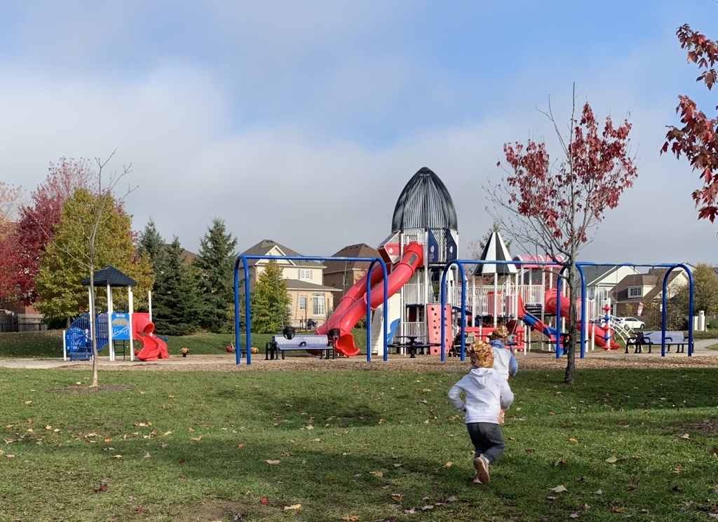 Children running towards a playground