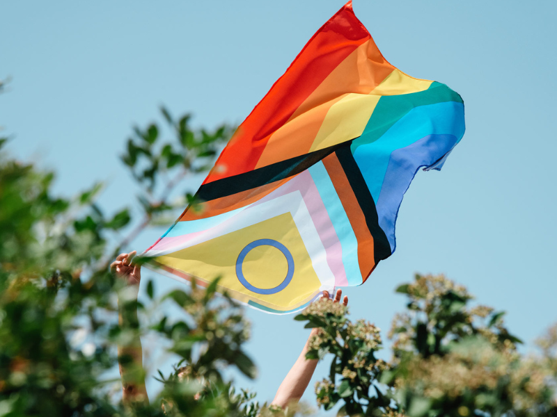 Inclusive Pride flag waving in the wind