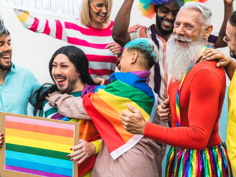 Image of a group of people celebrating at a Pride parade