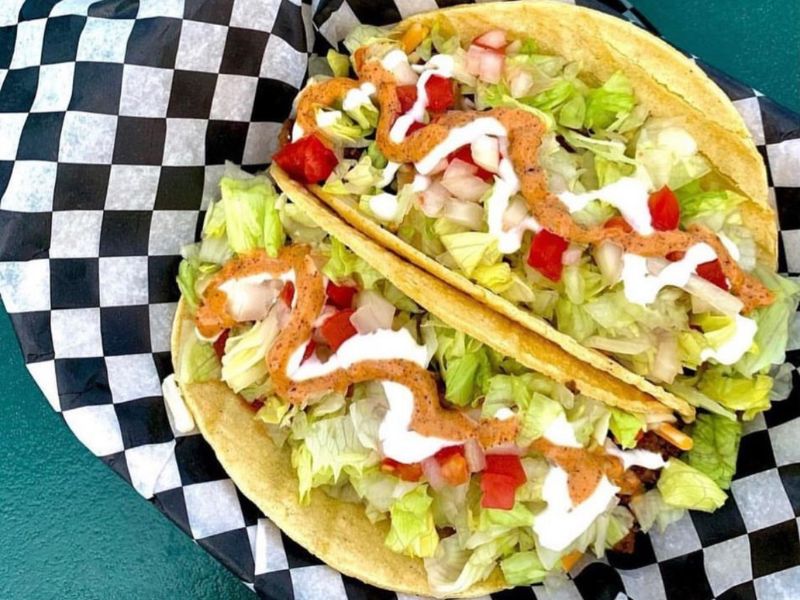 Image of two fully loaded tacos 